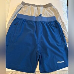 Pudolla running shorts size medium. 2 pairs size medium gray and blue good cond